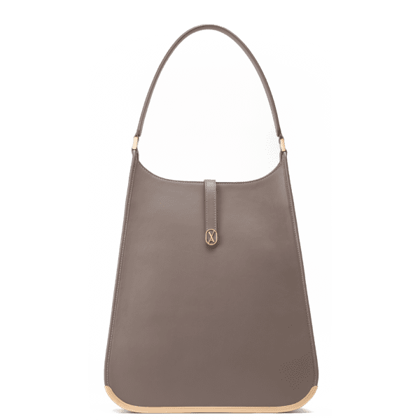 A large-sized taupe laptop bag with a minimalistic design and curved edges. It has a golden metal frame on the bottom and a golden magnet with the Vaulie icon in the center. This luxury ICON bag, made in Italy, is ideal for an elegant businesswoman.