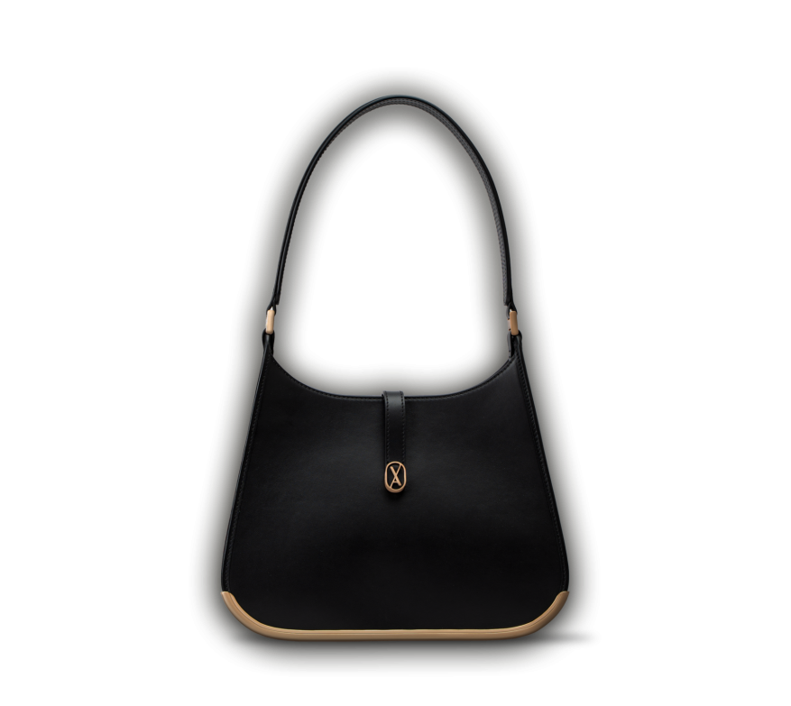 A medium-sized black bag with a minimalistic design and curved edges. It has a golden metal frame on the bottom and a golden magnet with the Vaulie icon in the center. This luxury ICON bag, made in Italy, is ideal for an elegant businesswoman.